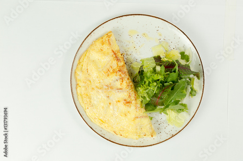omelette with salad on white background