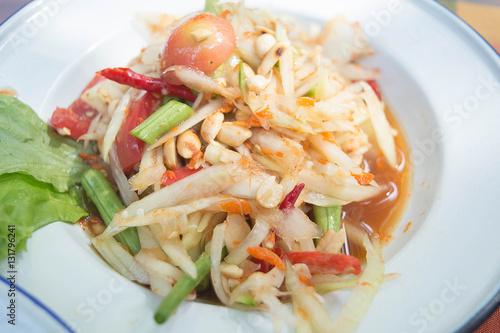 Green papaya salad is a spicy salad made from shredded unripe papaya. It is of Lao origin but it is also eaten throughout Southeast Asia.
