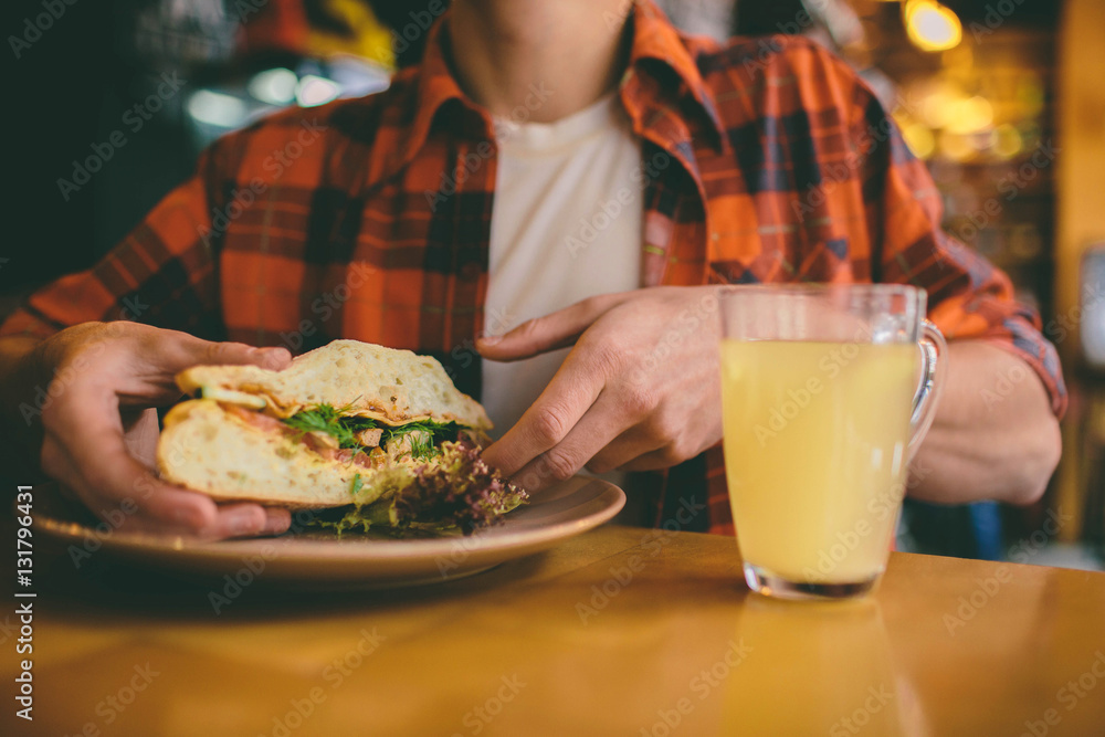 Man eating in a restaurant and enjoying delicious food Man eating in a restaurant and enjoying delicious food