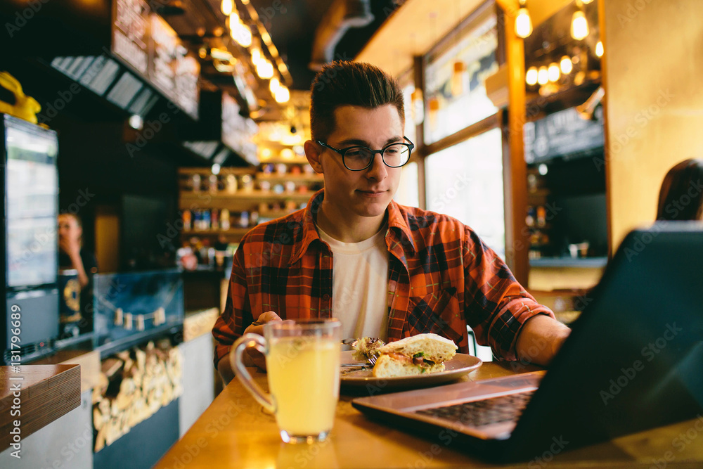 Man eating in a restaurant and enjoying delicious food Man eating in a restaurant and enjoying delicious food