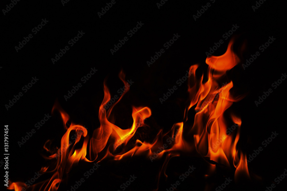 Obraz premium Fire flames on black background.