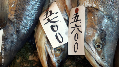 Fresh whole salmon sale in Japanese fish market photo