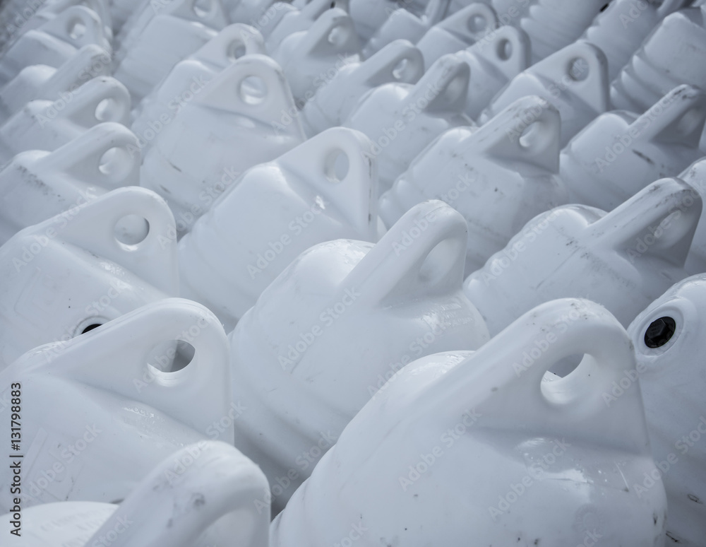 Obraz premium Marine themes, white buoys on the shore in the winter. Close up