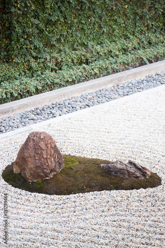 Zen gardens typically contain gravel and bare stones
