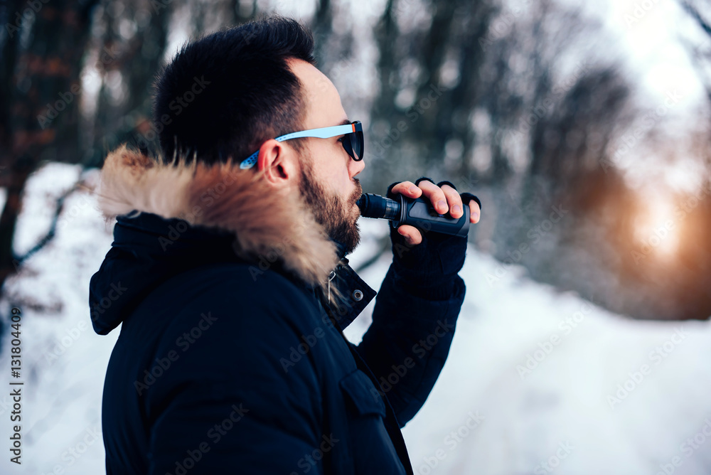 Man with beard vape electronic cigarette outdoor Man with beard vape electronic cigarette outdoor