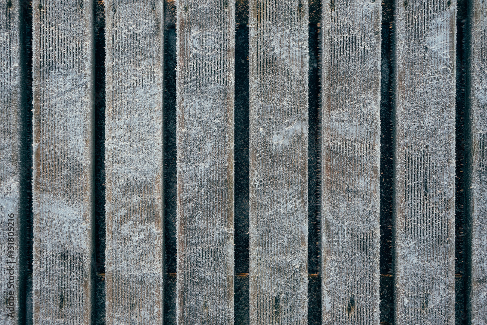 Fototapeta premium Wooden boardwalk covered with hoarfrost