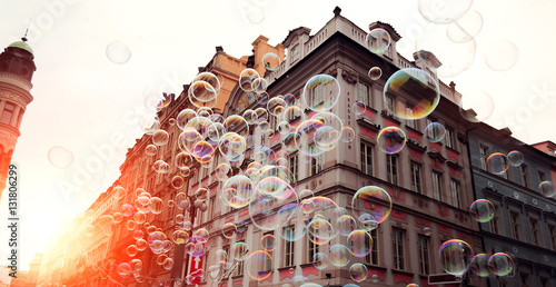 Soap bubbles in the center of Prague on the sun. photo