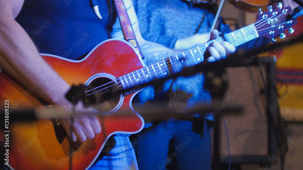 Muscular Musician Guitarists Plays Concert Acoustic Guitar In Night