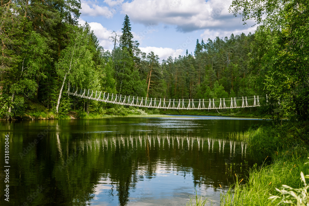 Fototapeta premium A beautiful hanging bridge in forest of Finland
