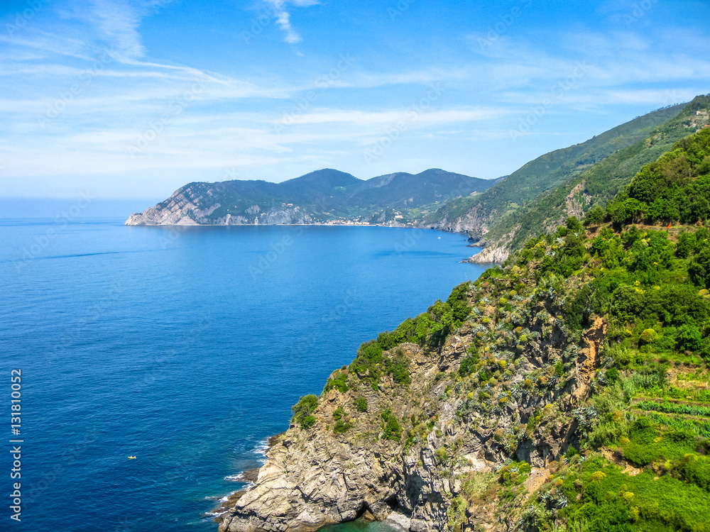 Ligurian coast view from the popular trail between Vernazza and Monterosso al Mare. Landscape of Cinque Terre, National Park and Unesco Heritage, Italy.