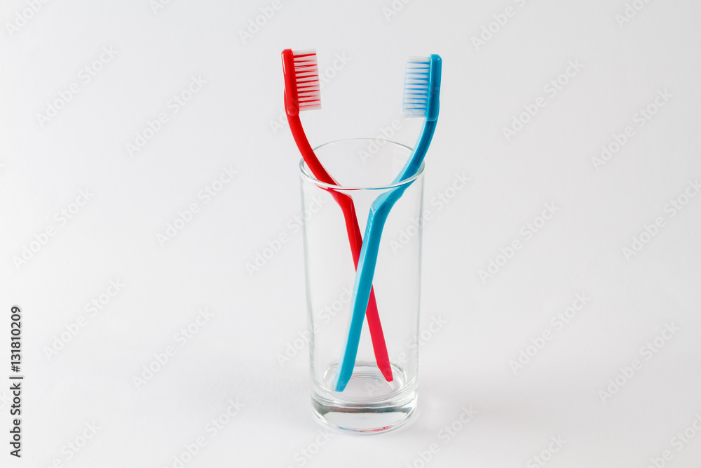 toth brushesin glass,on white bacground toth brushesin glass,on white bacground
