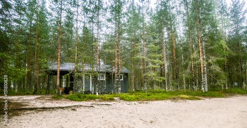A beautiful small wooden building in the middle of Finnish forest © dachux21