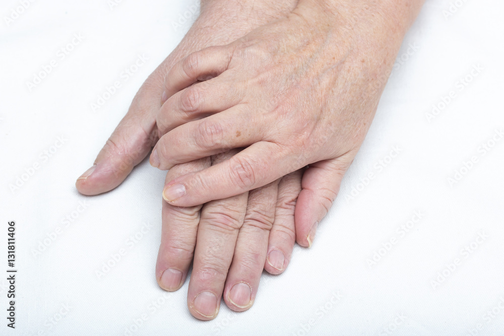 Fototapeta premium Elderly couple holding hands.