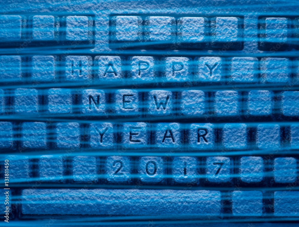 keyboard with inscription Happy New Year 2017 illuminated by blue light keyboard with inscription Happy New Year 2017 illuminated by blue light
