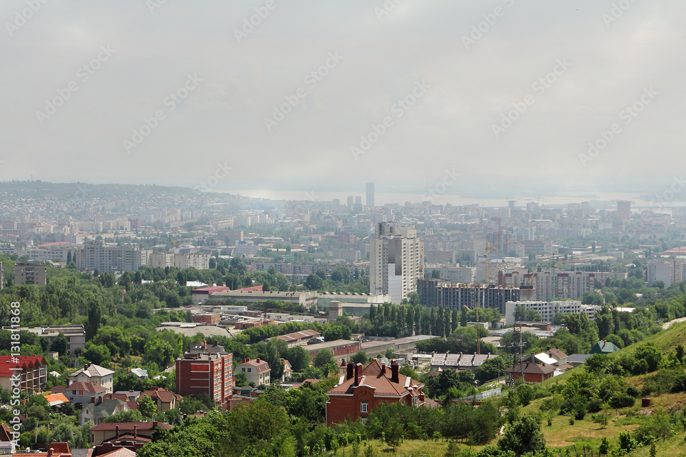 View of the city covered in smog from the bird's-eye view.