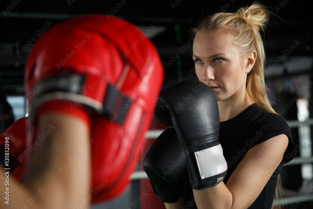 Young athletes trains in boxing