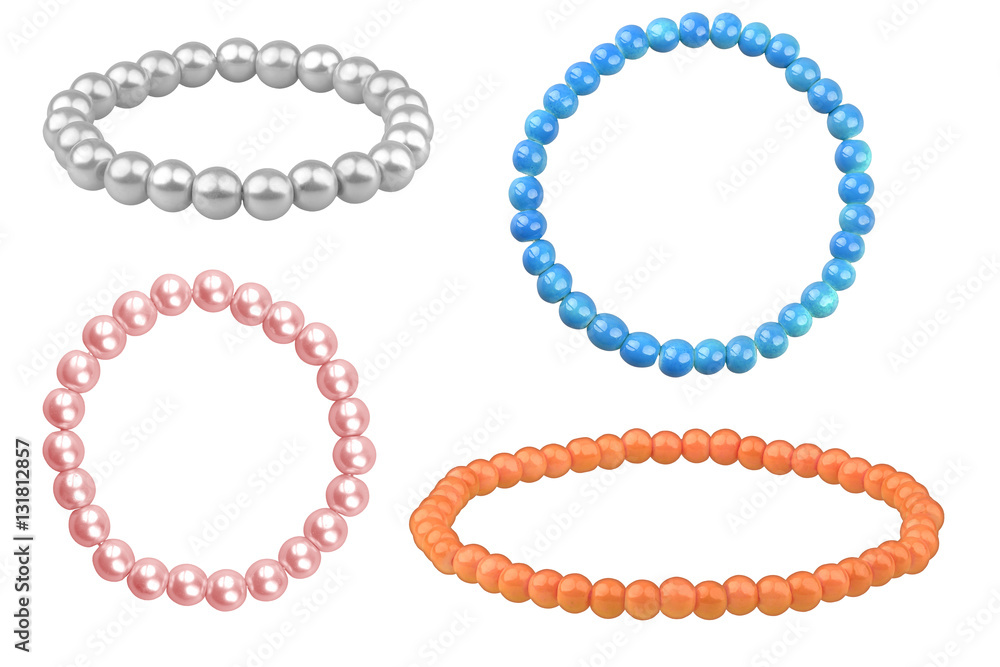 Four elastic bracelets made of pearl-like round beads (silver, blue, orange and pale pink), isolated on white background, clipping paths included Four elastic bracelets made of pearl-like round beads (silver, blue, orange and pale pink), isolated on white background, clipping paths included