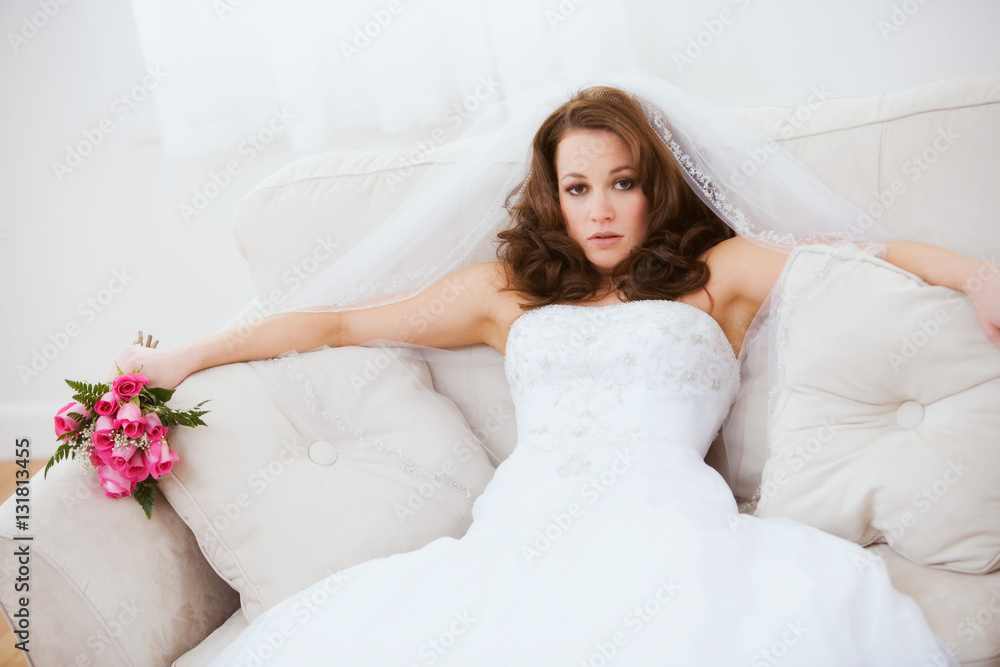 Bride: Annoyed Bride Sits On Couch with Bouquet Bride: Annoyed Bride Sits On Couch with Bouquet