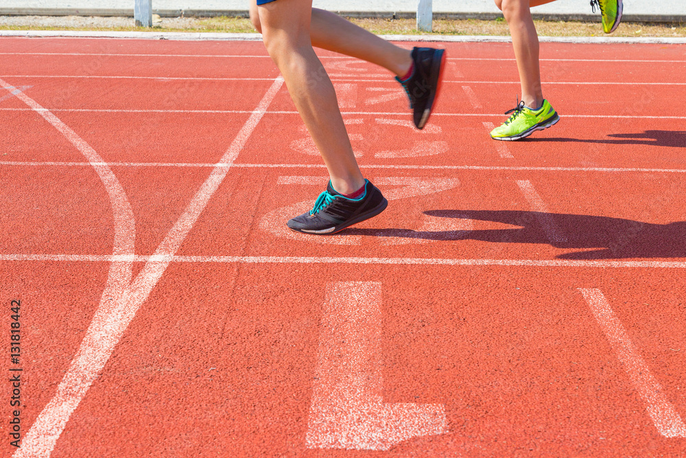 female runner feet running on track at finish line