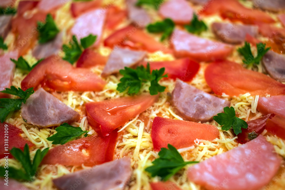 raw pizza with salami, parmesan cheese and tomato raw pizza with salami, parmesan cheese and tomato