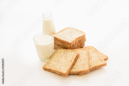 glass of milk and whole wheat bread