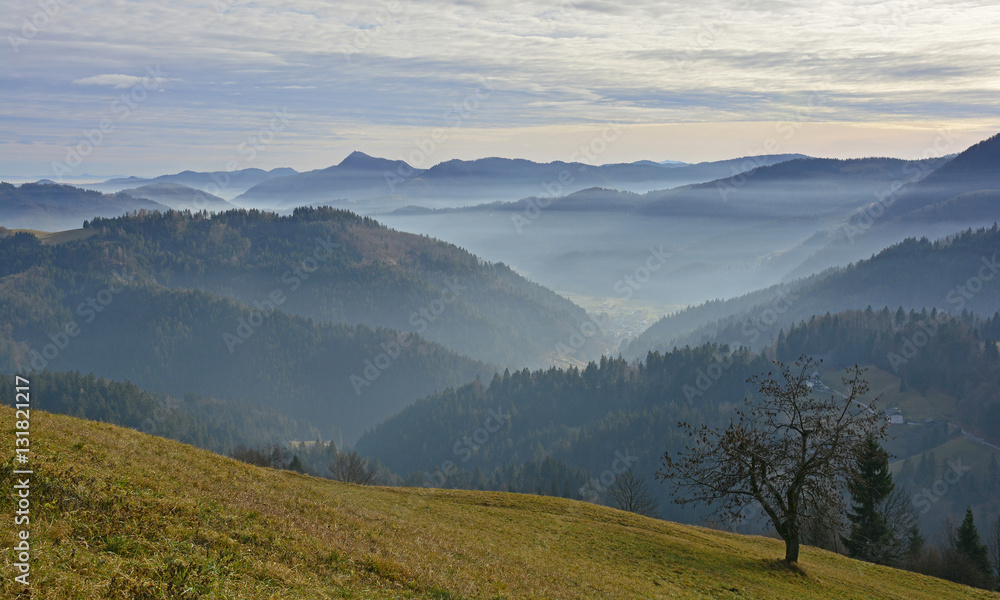 The landscape near Jamnik in north west Slovenia, with the Julian Alps in the background.
