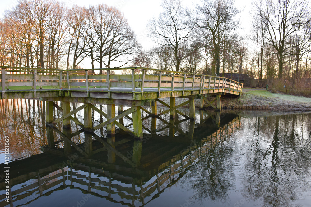 wooden bridge over the water in citypark