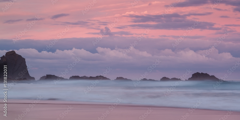 Magic seascape with pink sunset.