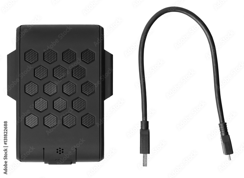 External hard drive in the protected rubber casing and a wire for it. Top view
External hard drive in the protected rubber casing and a wire for it. Top view