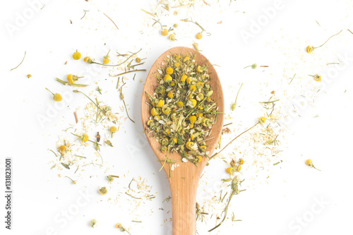 Dry Camomile Tea into a spoon
