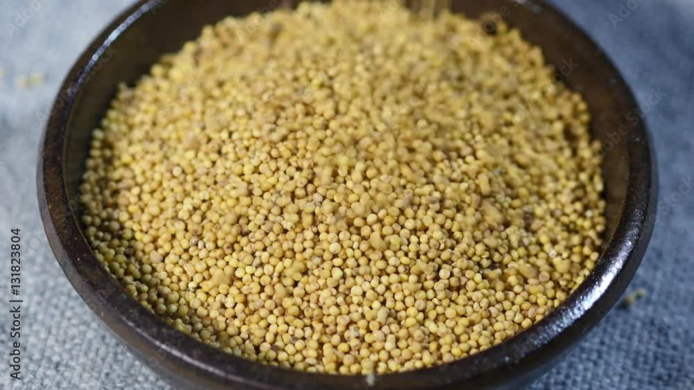 Droping mass of fresh Millets on a bowl. Droping mass of fresh Millets on a bowl.