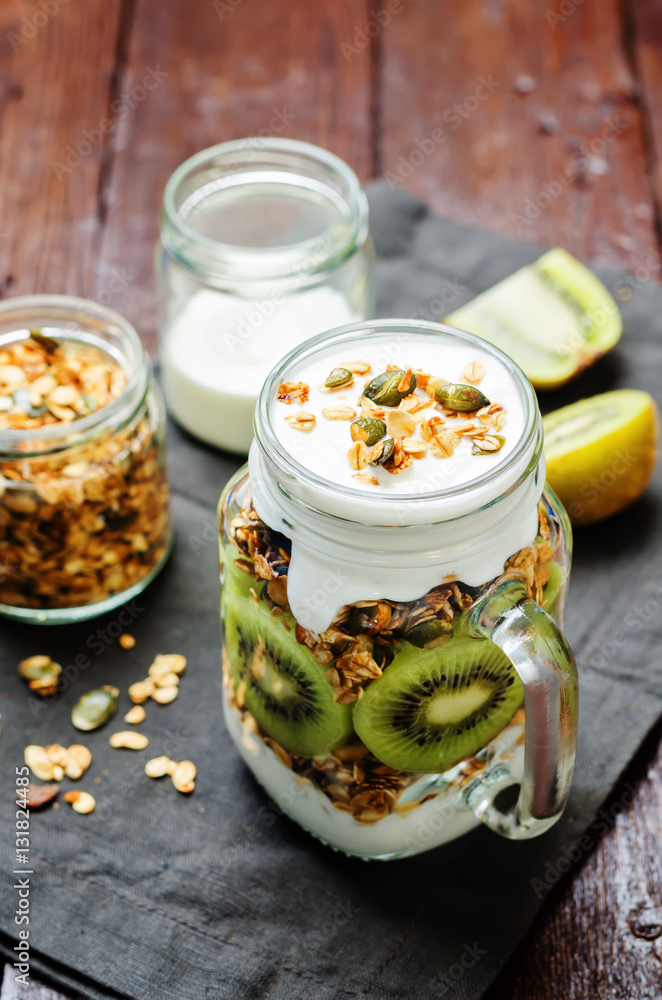 Greek yogurt granola kiwi breakfast in jar