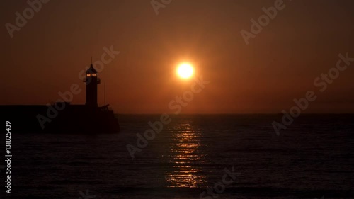 Wallpaper Mural Reflection of the rising sun in the sea. Wieden lighthouse Torontodigital.ca