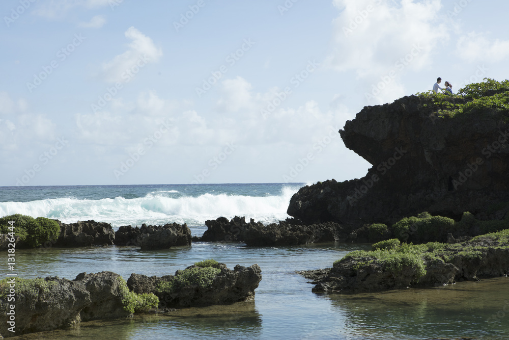 Waves crashing over rocks and cliff Waves crashing over rocks and cliff