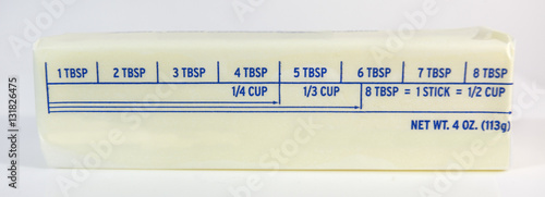 Stick of butter with tablespoon markings. Horizontal.