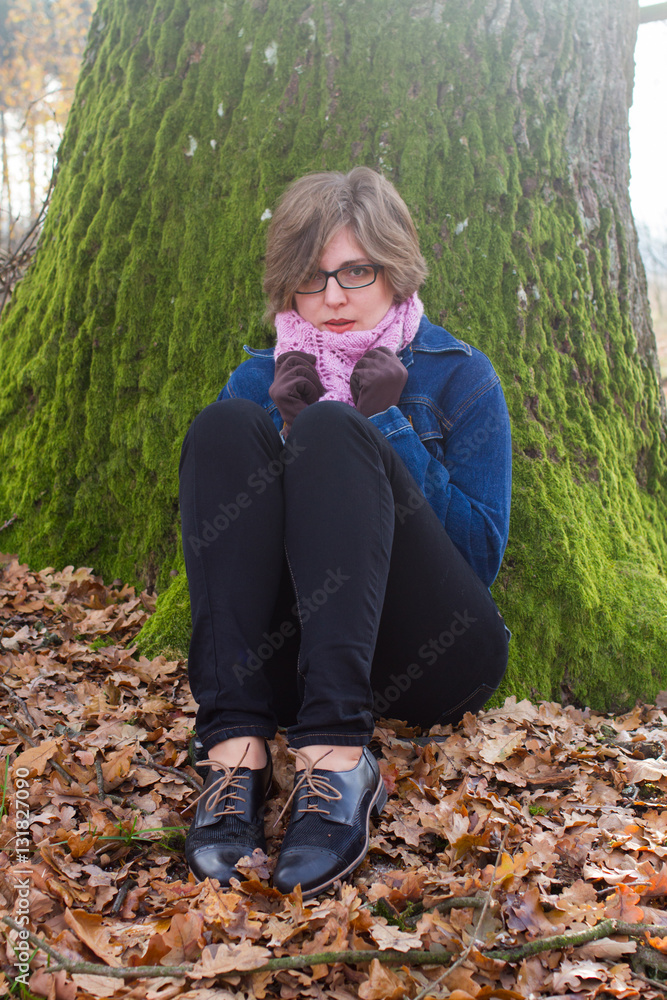 woman spending time in park during autumn season woman spending time in park during autumn season