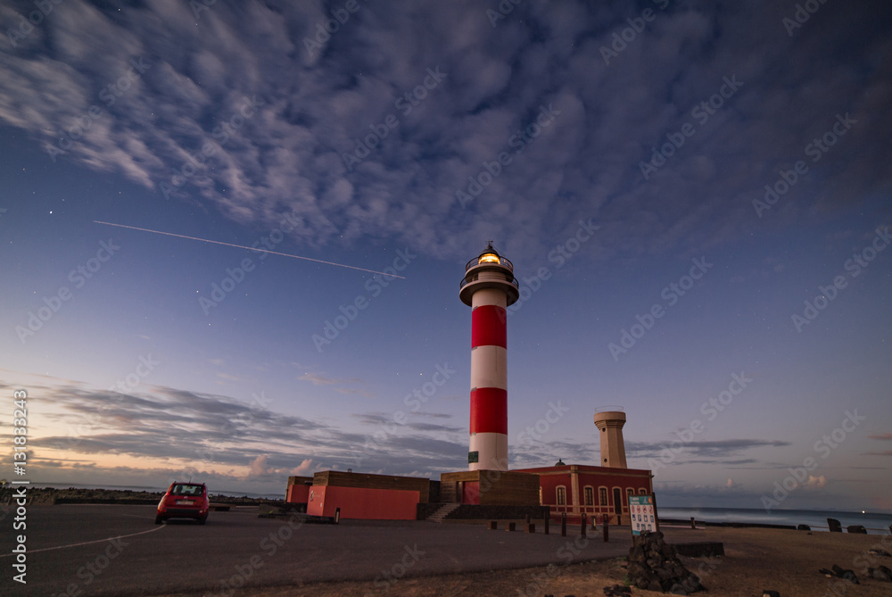 Lighthouse at El Cotillo Fuerteventura with airliner track