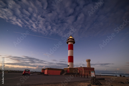 Lighthouse at El Cotillo Fuerteventura with airliner track