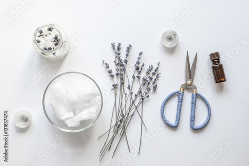 handmade candles with lavender on white background top view