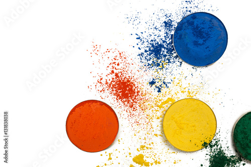 multi-colored pigments which are beautifully scattered on a table.