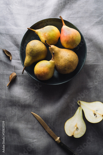 Pears in bowl on table