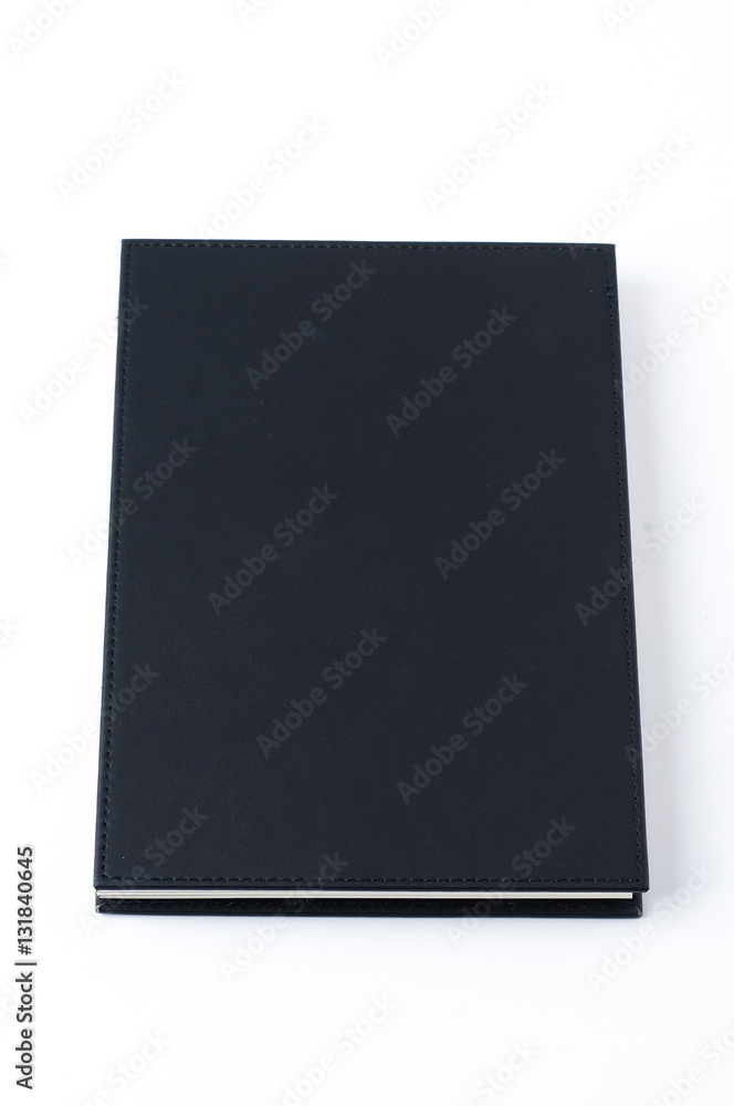 Black notebook on white background.