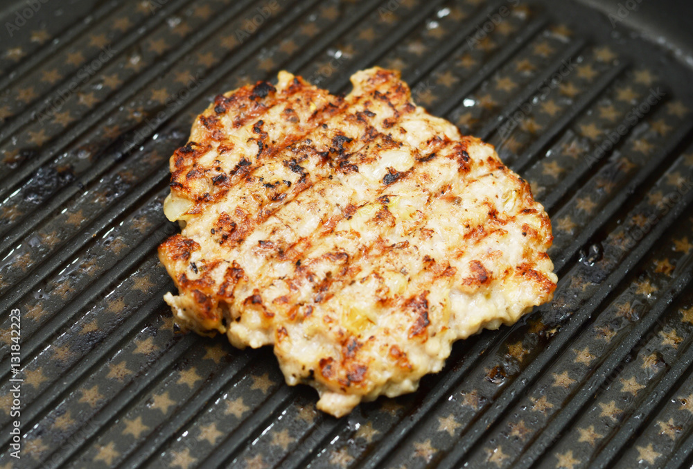 Hot Grilled steaks are cooking on grill pan Hot Grilled steaks are cooking on grill pan