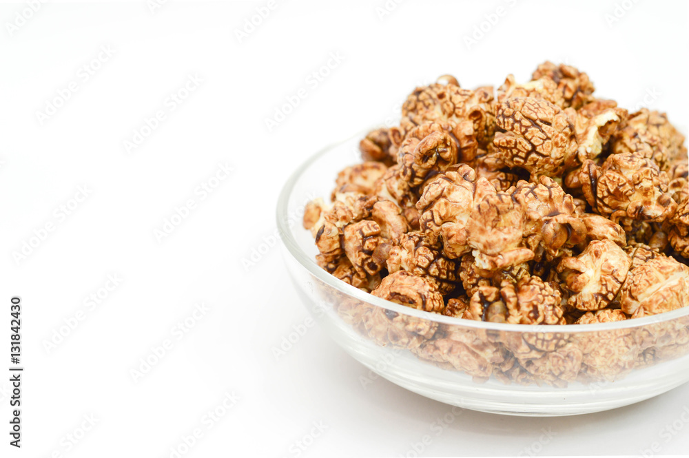 Image of chocolate popcorn in a glass bowl on white background a Image of chocolate popcorn in a glass bowl on white background a