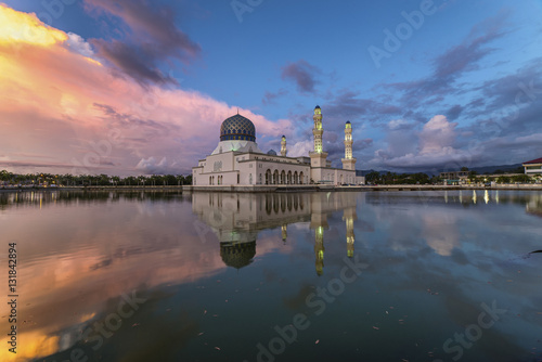 Beautiful twilight view City mosque in Kota Kinabalu, Sabah Borneo. Long exposure photograph with grain. Image contain certain grain or noise and soft focus.