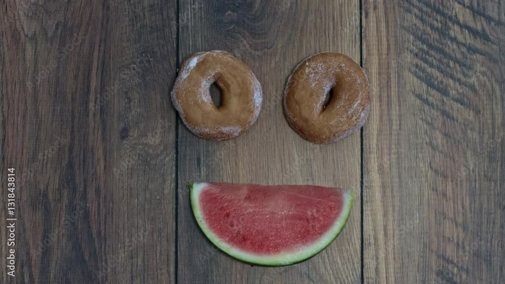 4k Donuts Composition on a Wooden Background with Watermelon Face 4k Donuts Composition on a Wooden Background with Watermelon Face