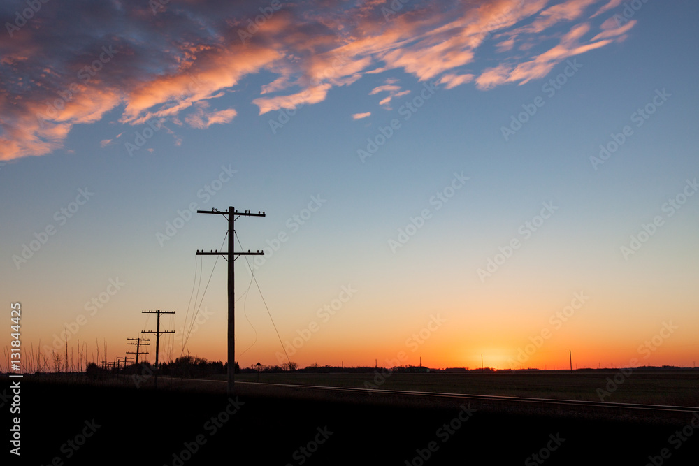 Silhouetted Telegraph Lines at Sunrise