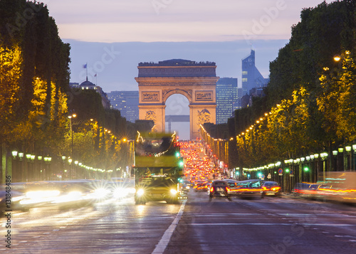 Paris city traffic on Champs Elysees boulevard