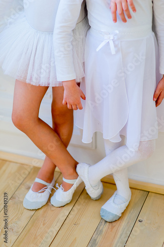 Two young ballet dancers learning the lesson