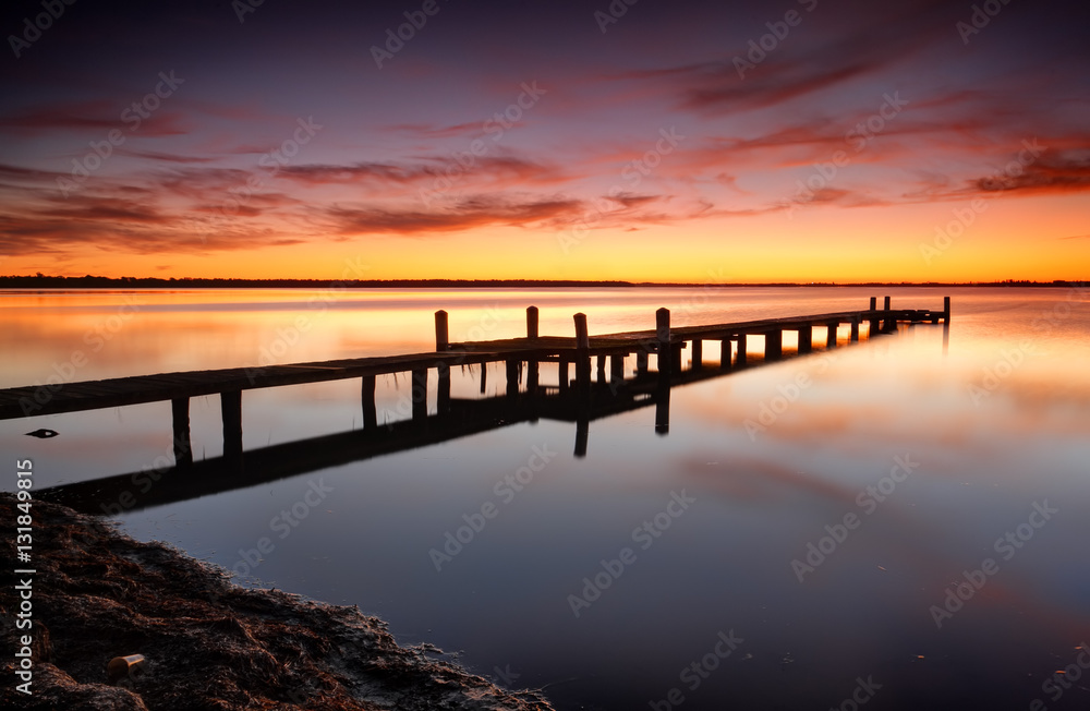 Beautiful skies over Tuggerah Lake with old jetty